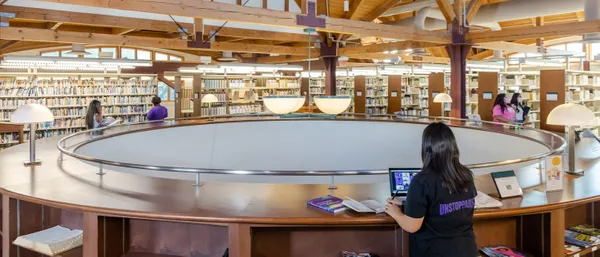 Student studying on the second floor of the Doheny library