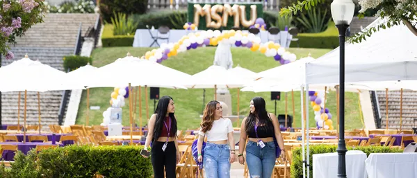 students listening to speaker at outdoor discusion