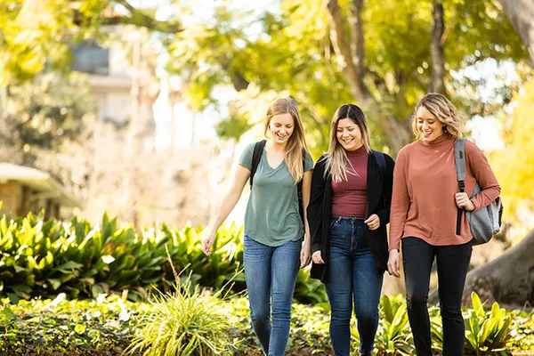 Three students walking