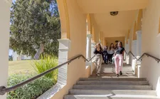 Student walk down the stairs at the Chalon Campus.