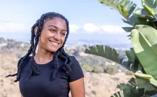 student smiling looking off in distance