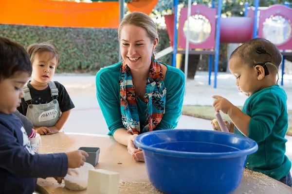 Teacher playing with students