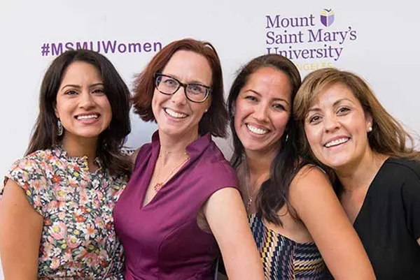 alumnae posing together