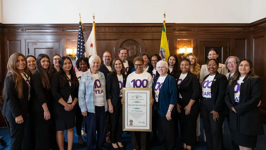 Members of the Mount Saint Mary’s University community stand with Los Angeles Mayor Karen Bass at City Hall as the city recognizes the Mount’s 100th anniversary.