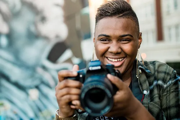 Student holding a camera