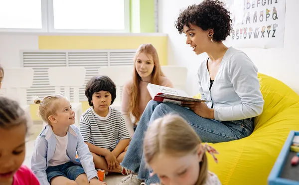 Teacher playing with children