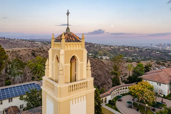 aerial shot of chapel tower with cross and los angeles in background