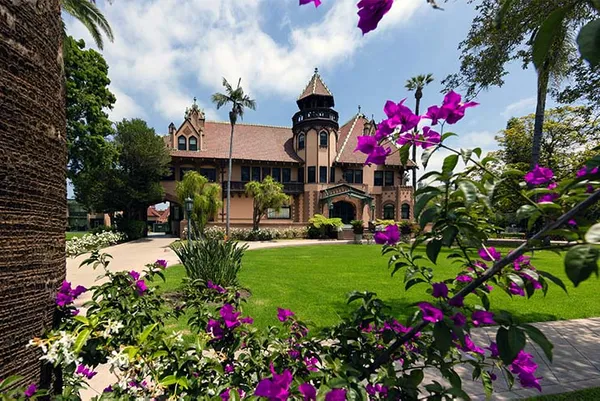 Doheny mansion with purple flowers