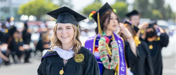 female student at graduation smiling