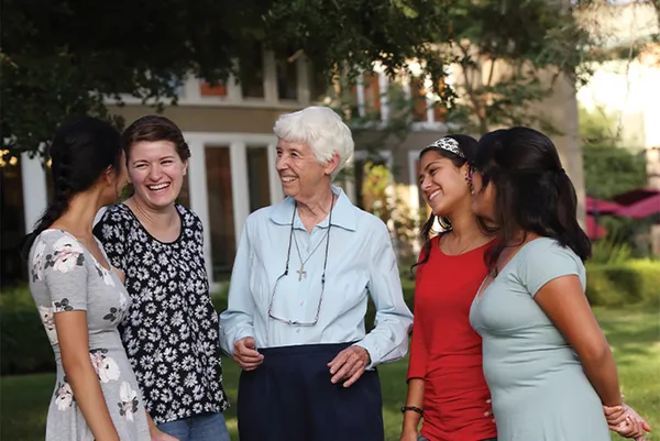 Mount students chatting and laughing with CSJ Sister