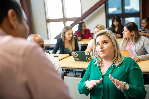 People talking in a classroom